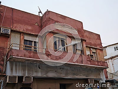 Abandoned and forsaken apartment building in a poor area of town Stock Photo