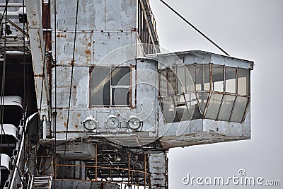 abandoned giant bucket wheel excavator stands in a field in winter Stock Photo