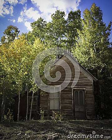 Abandoned Home from the 1800`s with Fall Colors in the Mountains Stock Photo
