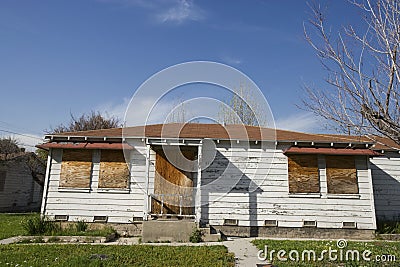 Abandoned House With Boarded Up Windows Stock Photo