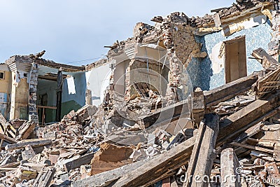 An abandoned house collapses. The house is destroyed. Cracks in wall of house. Destruction of old houses, earthquakes Stock Photo