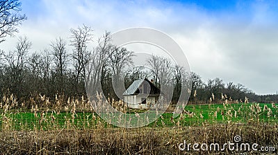 Abandoned house on an abandoned field. Stock Photo