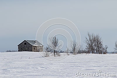 Abandoned house on a winter prairie Stock Photo