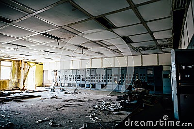 Abandoned industrial background, large ruined room with Iron cabinets Stock Photo