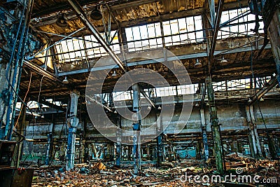 Abandoned industrial creepy warehouse inside old dark grunge factory building Stock Photo
