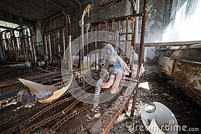 Abandoned kindergarten in Chernobyl Exclusion Zone. Lost toys, A broken doll. Atmosphere of fear and loneliness. Ukraine, ghost Stock Photo