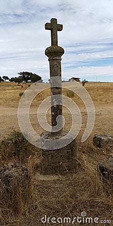Abandoned medieval cross in the fields. Pelorinho Stock Photo