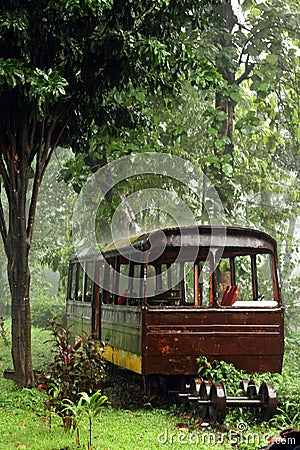 abandoned mini train on heavy rain Stock Photo