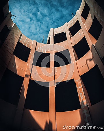 Abandoned old parking lot building under the blue sky Stock Photo