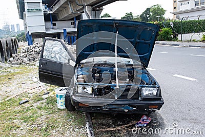 Abandoned old Proton Car in the street in Malaysia Editorial Stock Photo