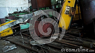 Abandoned old, useless details of machine tools in workshop, metal scrap. Many different parts of broken, outdated Stock Photo