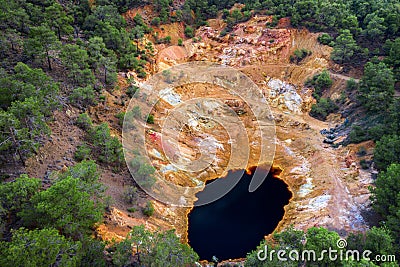 Abandoned open pit copper mine near Mathiatis, Cyprus. Aerial view on acidic red lake and colourful mine tailings Stock Photo