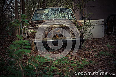 Abandoned and robbed old cars standing in the open air Editorial Stock Photo