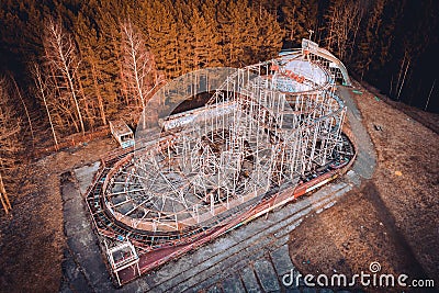 Abandoned roller coasters in carousel park. This abandoned park is in Elektrenai city in Lithuania, but feels like being in Stock Photo