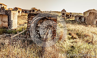 Abandoned ruin cemetery and overgrown landscape Stock Photo