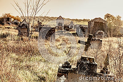 Abandoned ruin cemetery and overgrown landscape Stock Photo
