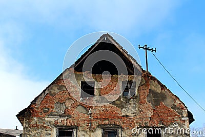 Abandoned ruined house closeup of broken walls and missing bricks Stock Photo