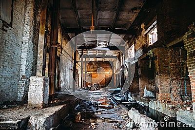 Abandoned ruined industrial factory building, corridor view with perspective, ruins and demolition concept Stock Photo