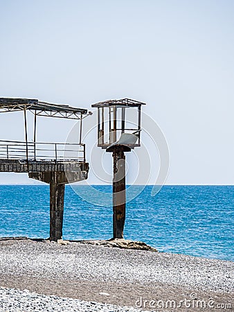 Abandoned and ruined piers on the seashore Stock Photo