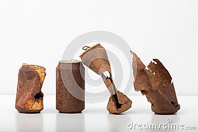 Abandoned Rusty Soda and Beer Cans on White Background, urgent call for recycling Stock Photo