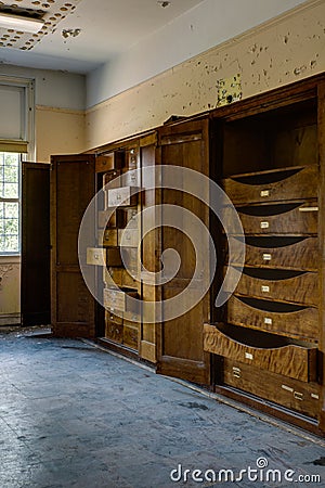 Abandoned School Home Economics Classroom with Wood Drawers Stock Photo