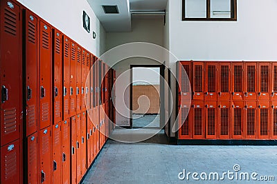 Abandoned School Locker Room with Orange Lockers Stock Photo