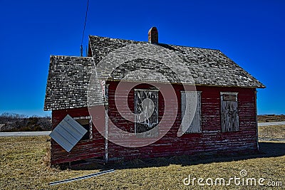 Abandoned schoolhouse near lineville IA now a feature of a highway rest area Stock Photo