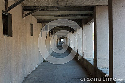 Abandoned square stone tunnel in the perspective Stock Photo