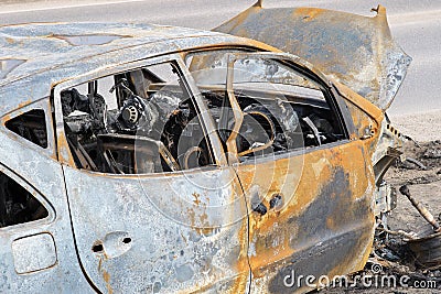 Body of the burnt car in the street Stock Photo