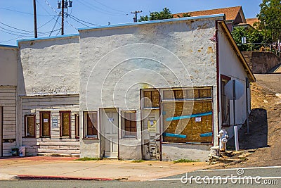 Abandoned Store Front With Boarded Up Windows Stock Photo