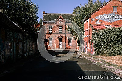 Abandoned street with brick buildings in the town of Doel, Belgium Editorial Stock Photo