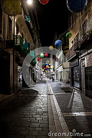 Abandoned Street With Shops In The Illuminated City Of Carcassonne In The Night In Occitania, France Editorial Stock Photo
