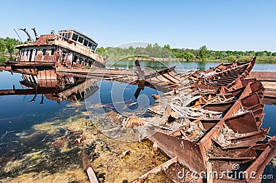 Abandoned sunken Barges Boats On River Pripyat in Chernobyl exclusion Zone. Chernobyl Nuclear Power Plant Zone of Alienation in Stock Photo