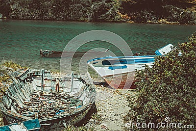 Abandoned and sunken boats in a river. Stock Photo