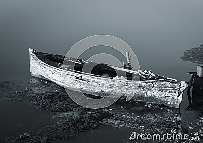 Abandoned sunken wooden boat Stock Photo