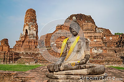 Abandoned temple in Ayutthaya Thailand with Buddha statue in front Stock Photo