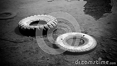 Abandoned tire on the water sea or lake pond with black and white style color Stock Photo