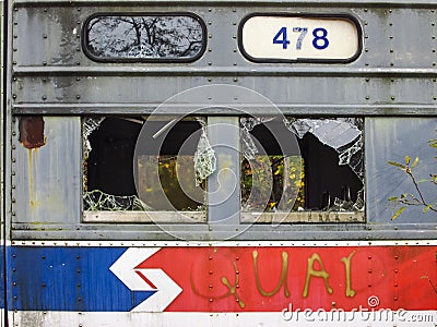 Abandoned trolley cars side view with route number and broken windows Editorial Stock Photo