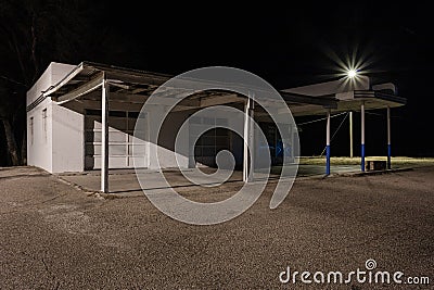 Abandoned vintage service station at night Stock Photo