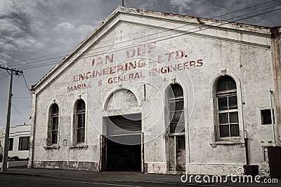 An abandoned warehouse in the village of Bluff in New Zealand Editorial Stock Photo