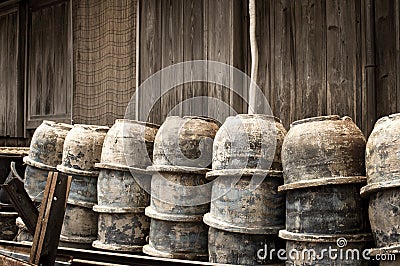 Abandoned pottery bowls stacked outside Stock Photo