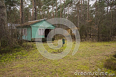 Abandoned wooden mobile homes in a forgotten, abandoned holiday resort on an autumn day. Mess Stock Photo