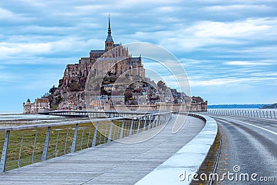 Abbey fortress mont saint michel at sunset. Stock Photo