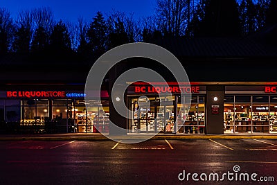 ABBOTSFORD, CANADA - FEBRUARY 10, 2020: bc liquor store retail store strip mall in early morning Editorial Stock Photo