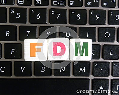 Abbreviation FDM on keyboard background Stock Photo