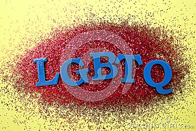 Abbreviation LGBTQ with glitters on color background Stock Photo