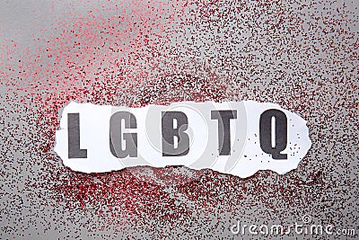 Abbreviation LGBTQ with glitters on grey background Stock Photo