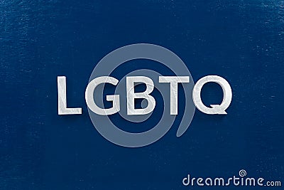 The abbreviation lgbtq - lesbian, gay, bisexual, transgendered, and queer laid with white letters on dark blue flat background Stock Photo