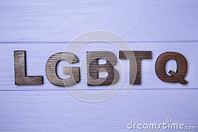 Abbreviation LGBTQ on wooden background Stock Photo