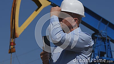 Confident Petroleum Engineer Working in Extracting Oil Industry Checking Install Stock Photo